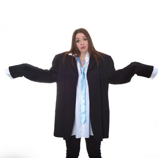 Natalie Thompson confused in oversized suit Accounting Connections
